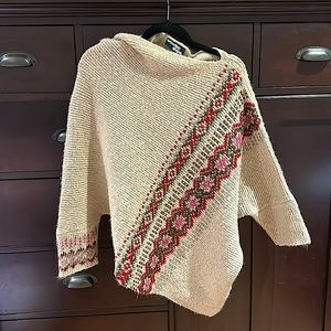 Asymmetrical sweater with beautiful detail. Wool, mohair, and acrylic blend.